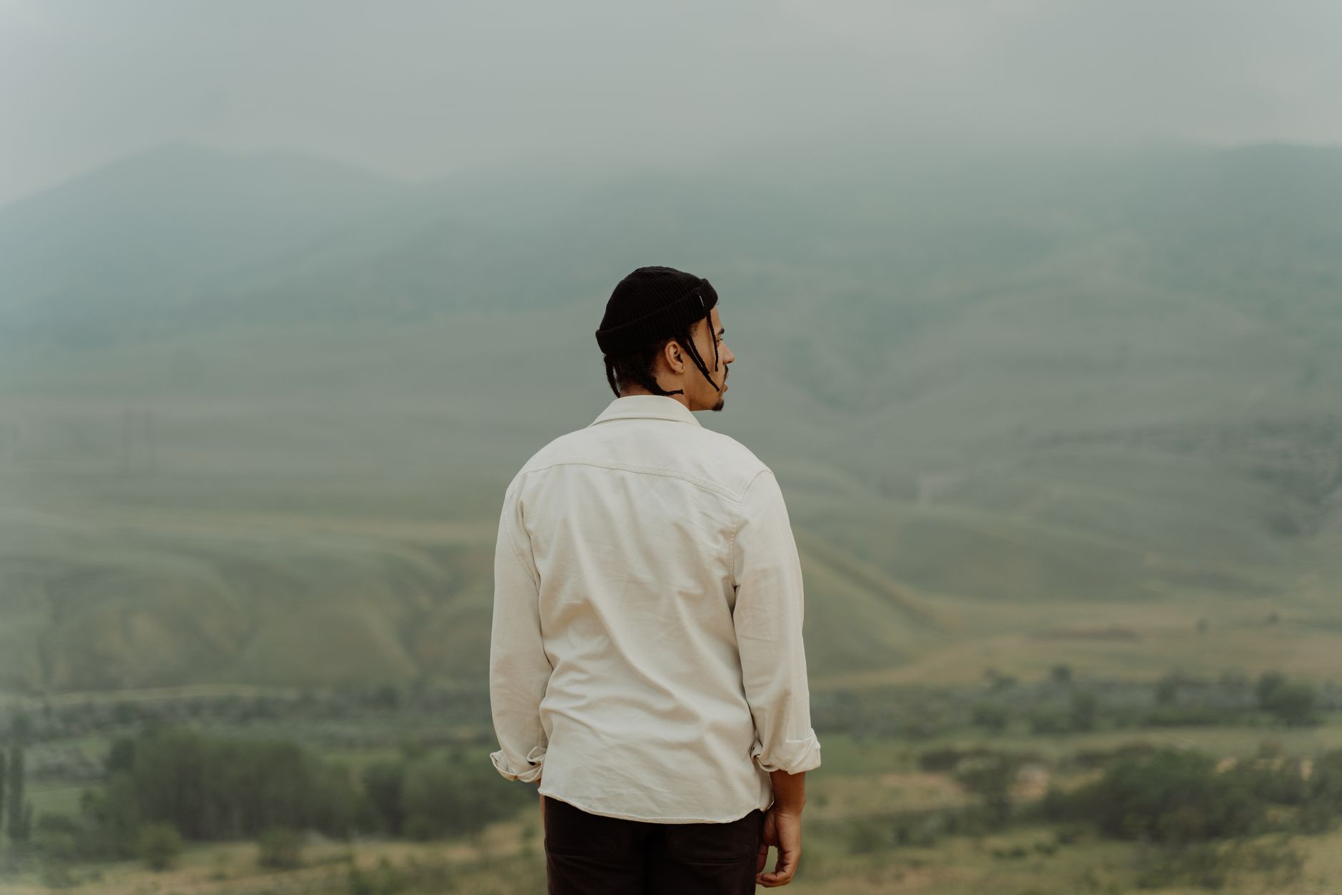 Travel writer taking notes at a scenic mountain overlook